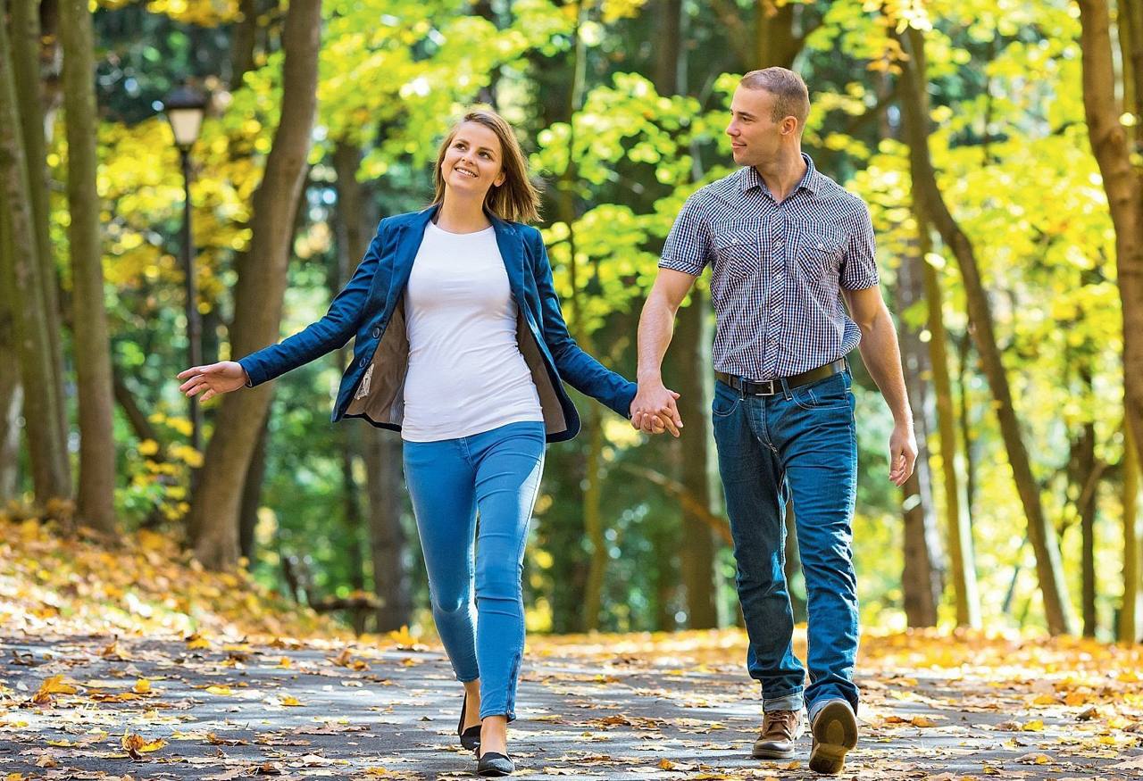 Happy couple walking in the park