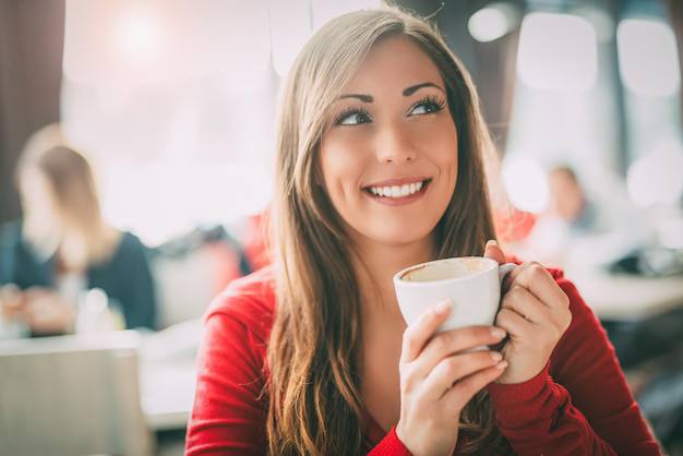 Smiling woman with a coffee cup